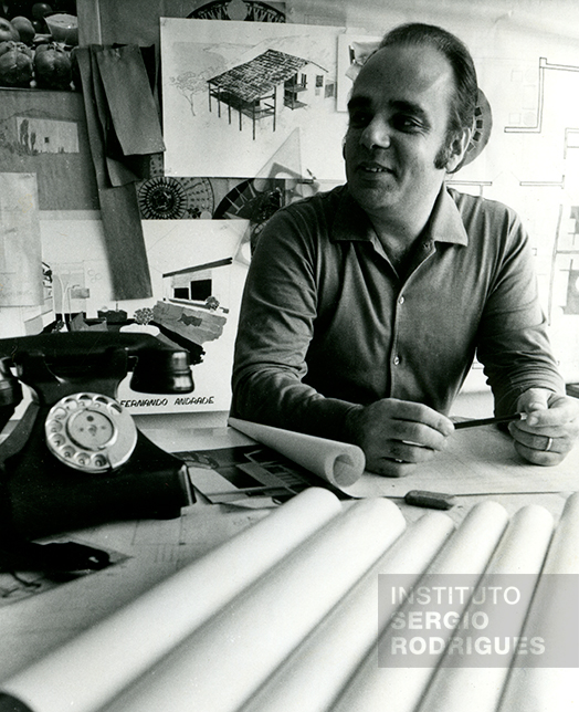 Sergio Rodrigues, at approximately age 43, in his office located at Rua No. 14 - store c, Ipanema - Rio de Janeiro, in the early 1970s.