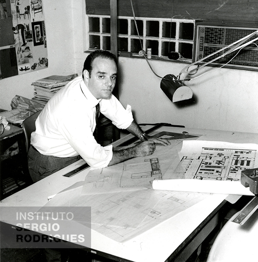 Sergio Rodrigues, at age 39, in his office at the Oca store, located at Rua Jangadeiros No. 14 - store c, Ipanema - Rio de Janeiro, in 1966.