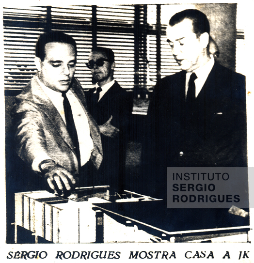 Sergio Rodrigues showing a mockup to Juscelino Kubitschek, the then president of Brazil, at the 